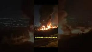 伊朗百姓坐在屋顶看以色列轰炸德黑兰。